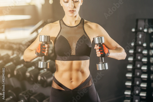 Classic bodybuilding. Muscular fitness woman doing exercises in the gym. Fitness - concept of healthy lifestyle. Fitness woman in the gym. Crossfit woman. Bodybuilder woman in the gym.