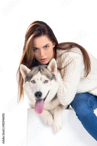 beautiful girl hugging husky dog  isolated on white