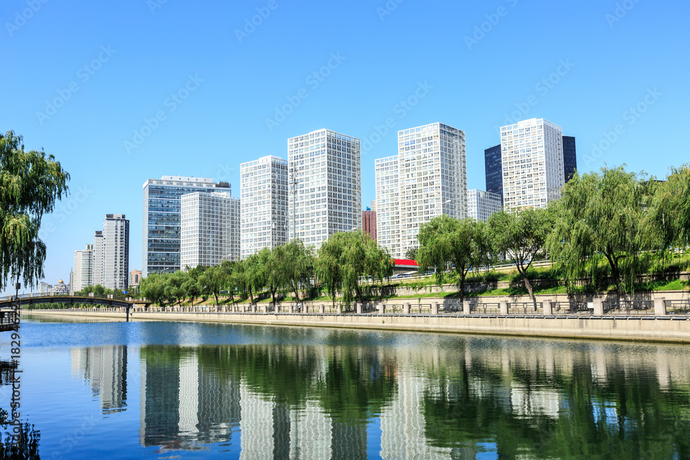 Business district office buildings and water reflection in Beijing