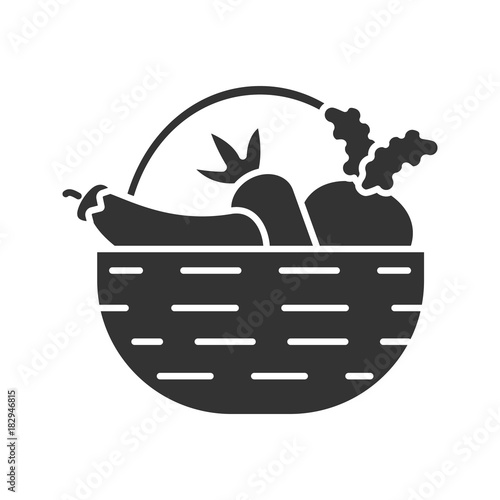 Basket with vegetables glyph icon