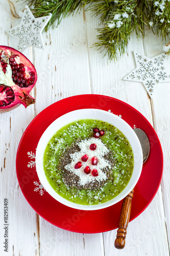 Christmas food healthy idea. Green smoothies decorated with Chri