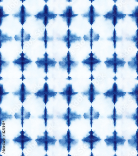 Seamless pattern, abstract tie dyed fabric of indigo color on white cotton. Hand painted fabrics. Shibori dyeing photo