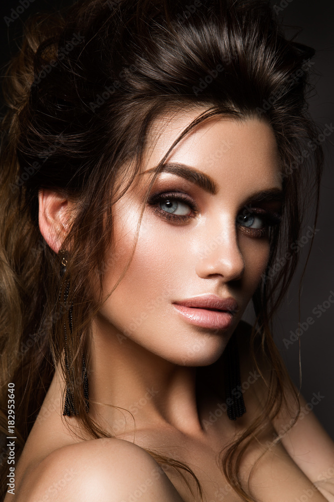 Fototapeta premium Beautiful woman with professional make up and hairstyle