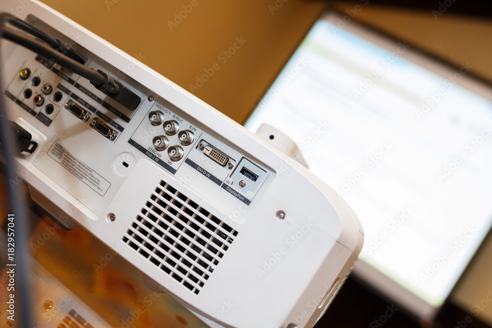 white projector on the table prepared to broadcast video presentation. white projector on the table prepared to broadcast video presentation.