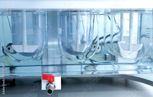 Autonomous solubility tester. Imitation dissolution of the tablet in the human stomach. Scientific research of pharmaceutical laboratory. Laboratory research in pharmacy.