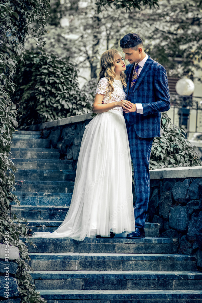 happy couple standing near modern city center