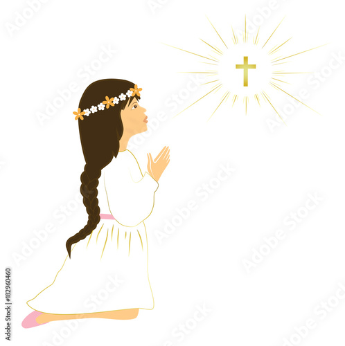 Long brown hair girl praying on her first holy communion day.