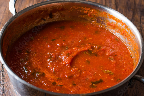 Tomato Sauce with Herbs in Metal Pot