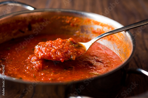 Tomato Sauce with Spoon in Metal Pan