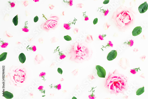 Floral pattern with pink roses, petals and leaves on white background. Flat lay, top view. Valentines day background
