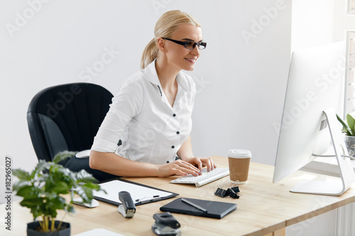 Business People. Woman Working On Computer In Office photo