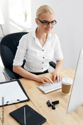 Business People. Woman Working On Computer In Office photo