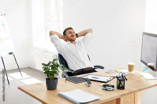 Worker Relaxing In Office. Relaxed Man At Work