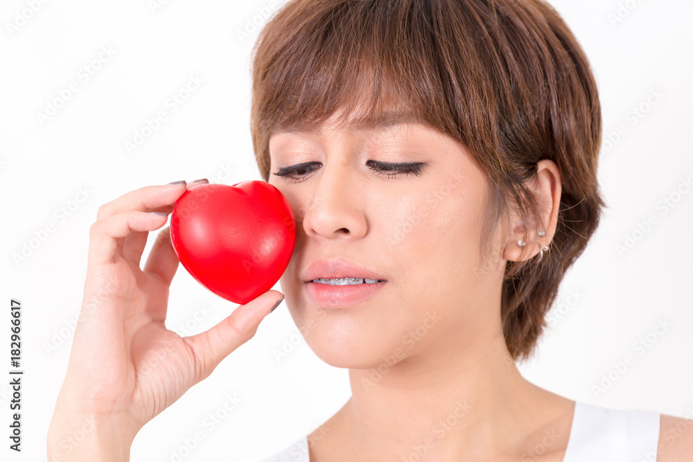 Beautiful young asia woman with red heart. Isolated on white background. Studio lighting. Concept for healthy. Beautiful young asia woman with red heart. Isolated on white background. Studio lighting. Concept for healthy.