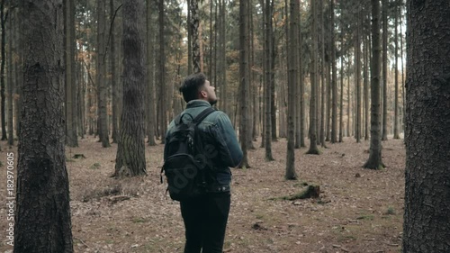 Wallpaper Mural Young Bearded Man Walking In Autumn Forest With a Touristic Backpack, Autumn Style, Travelling Lifestyle Torontodigital.ca