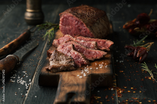 Grilled steak with spices and herbs