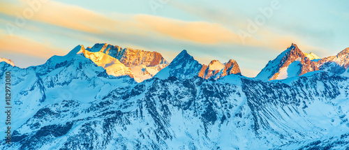 Mountains peaks with snow at sunset, panorama landscape