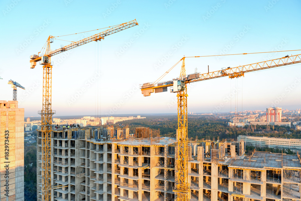 Cranes on industrial building site Cranes on industrial building site