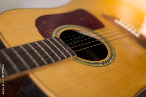 detail of classic guitar and strings with shallow depth of field