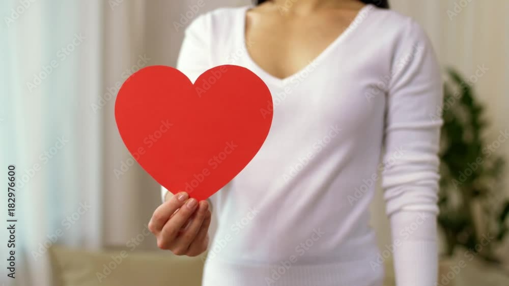 woman with heart and gay pride awareness ribbon woman with heart and gay pride awareness ribbon