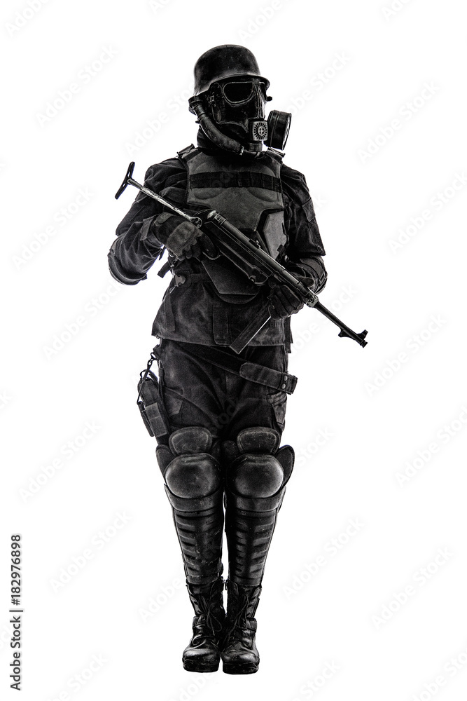 Futuristic nazi soldier sentinel gas mask and steel helmet with schmeisser handgun isolated on white studio shot standing to attention profile Futuristic nazi soldier sentinel gas mask and steel helmet with schmeisser handgun isolated on white studio shot standing to attention profile
