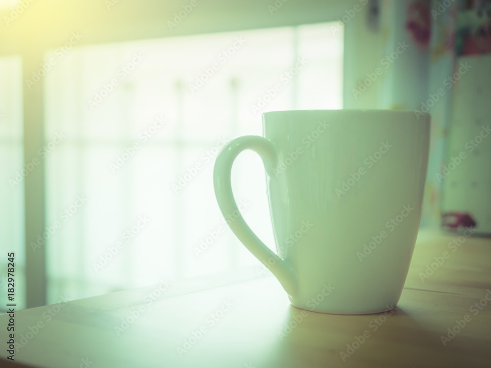hot coffee morning breakfast in white cup put on wooden table with soft focus background hot coffee morning breakfast in white cup put on wooden table with soft focus background