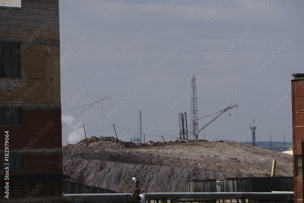 Salt production in the Saline With excavator and transportation belt conveyor, sea salt is transported on salt hills.