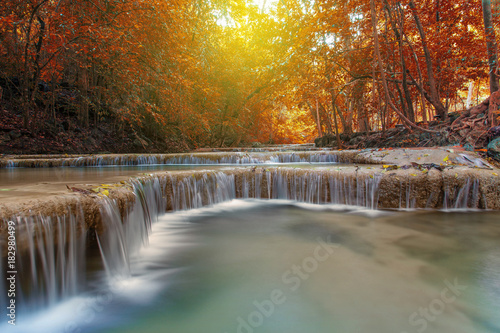Fototapeta Naklejka Na Ścianę i Meble -  Waterfall with tree in autumn forest
