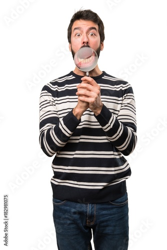 Man with beard with magnifying glass