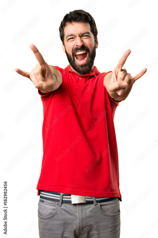 Handsome man making rock gesture Handsome man making rock gesture