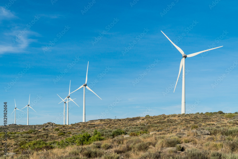 Wind turbines in a rocky mountains in Portugal Wind turbines in a rocky mountains in Portugal