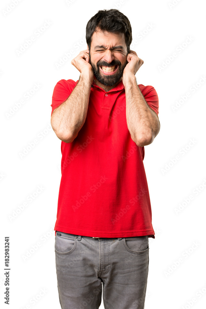Handsome man covering his ears Handsome man covering his ears