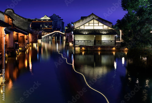 Night view of the ancient building by the water in Wuzhen. Wuzhen - historic ancient water town, part of Tongxiang, located in northern Zhejiang Province, China