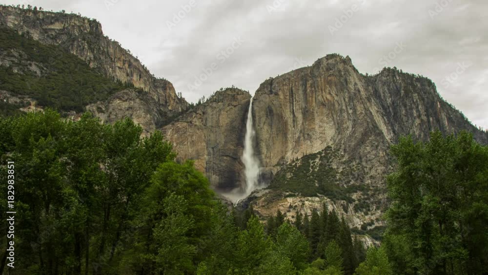 Time lapse cloudy morning of Cascade Falls at Yosemite Valley in Yosemite Nation Park, California, USA Time lapse cloudy morning of Cascade Falls at Yosemite Valley in Yosemite Nation Park, California, USA