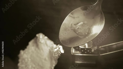 preparation of narcotic substance in the spoon on fire