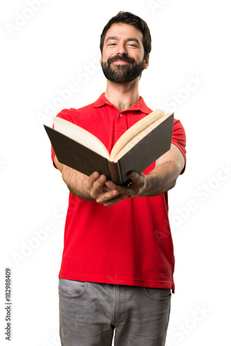 Happy Handsome man reading a book