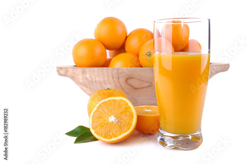 glass of orange juice with fruit and press citrus on white background