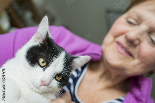 old woman with a cat - animal therapy for old people