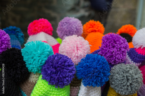 close up of colored pom poms