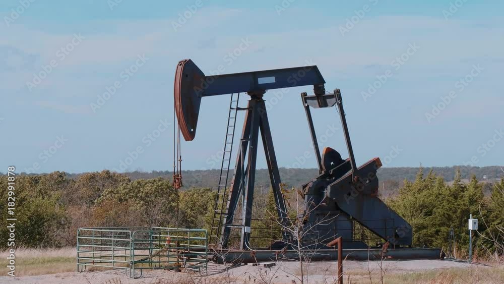 Oil pump in the countryside of Oklahoma - Pump jack Oil pump in the countryside of Oklahoma - Pump jack