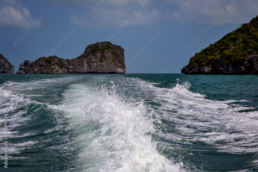 waves behind the speedboat in the background Rocks marine reserve in Thailand