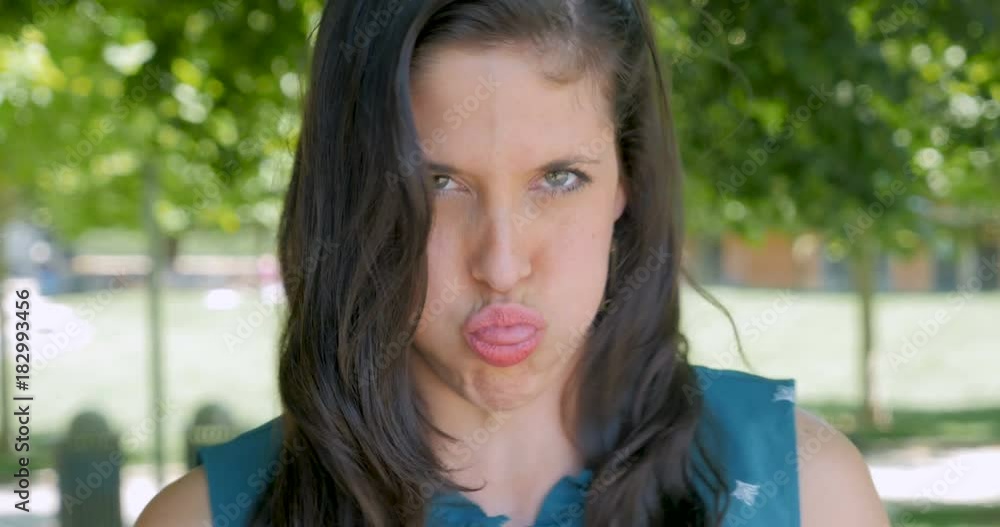 Woman blowing a raspberry showing derision mockery and ridicule Stock