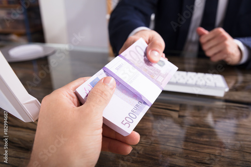 Businessperson Taking Bribe In Office
