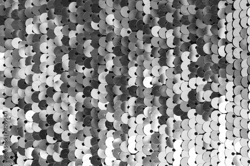 Grey sequins pattern. Sparkling sequins background.