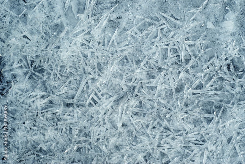 background, texture: surface of water during freezing; a lot of ice crystals welded into a single surface background, texture: surface of water during freezing; a lot of ice crystals welded into a single surface