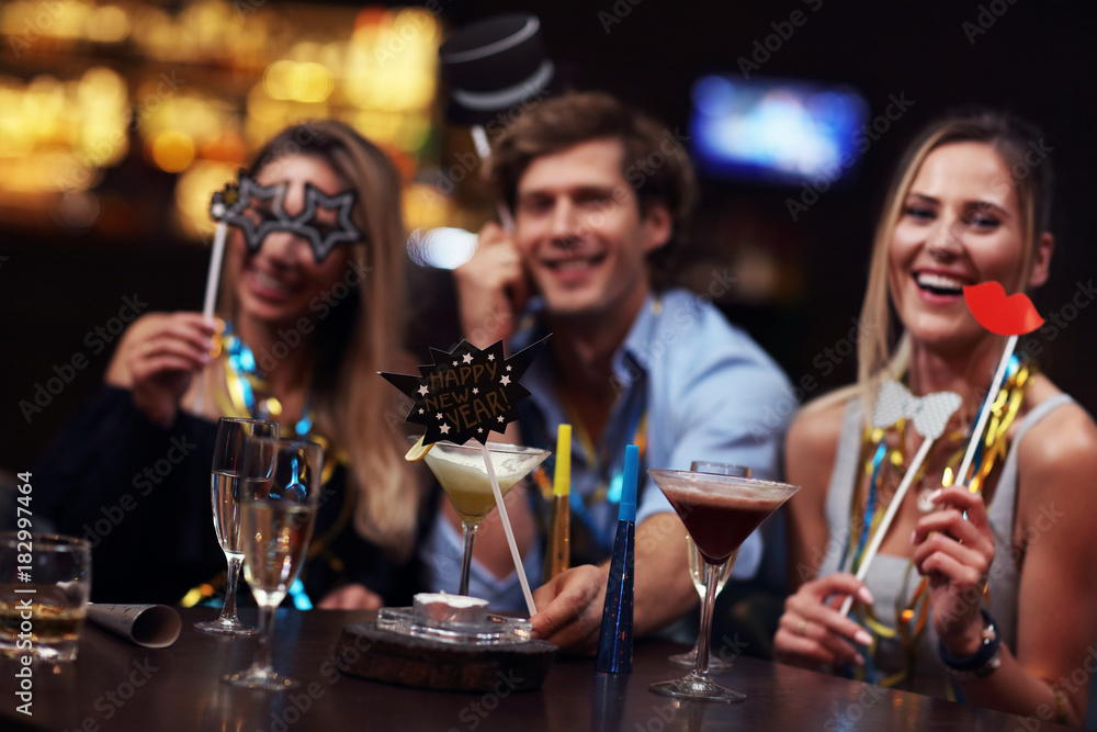 Group Of Friends Enjoying Drink in Bar