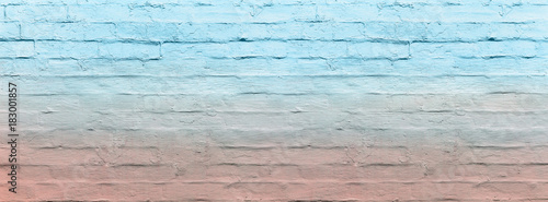 banner brick wall covered with ombre blue and pink lime