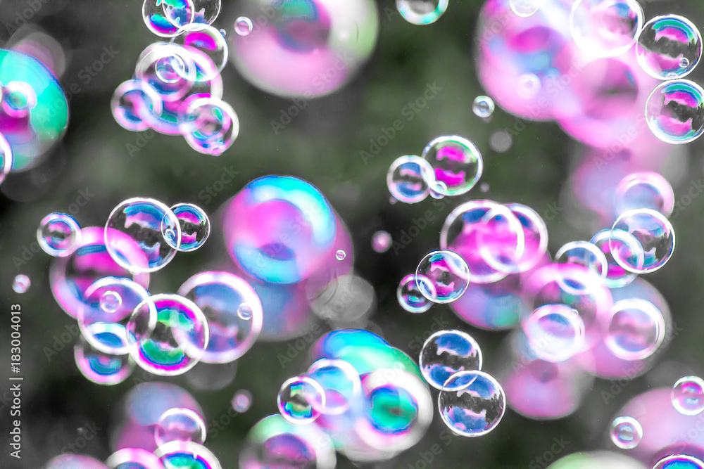 Soap bubbles in nature as background for design blur Soap bubbles in nature as background for design blur