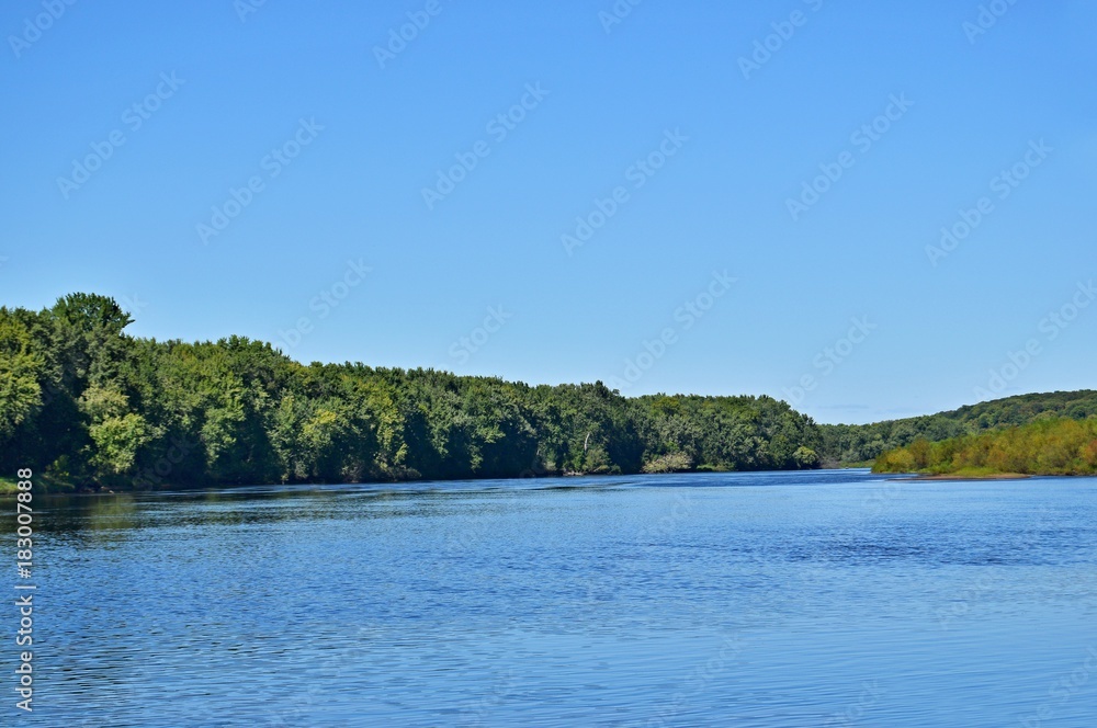 river with bright blue sky