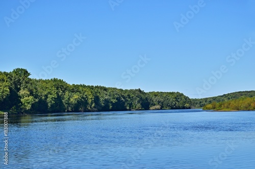 river with bright blue sky